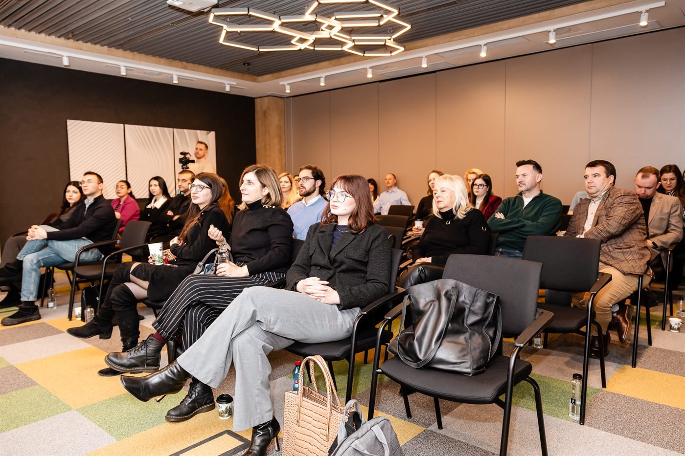 Attendees seated in the workshop room
