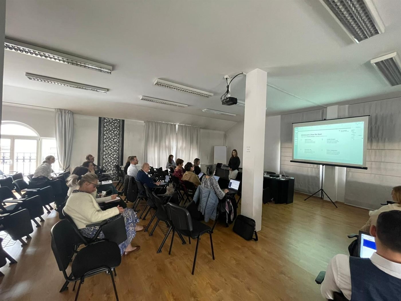 Attendees working on laptops during the Cluj session