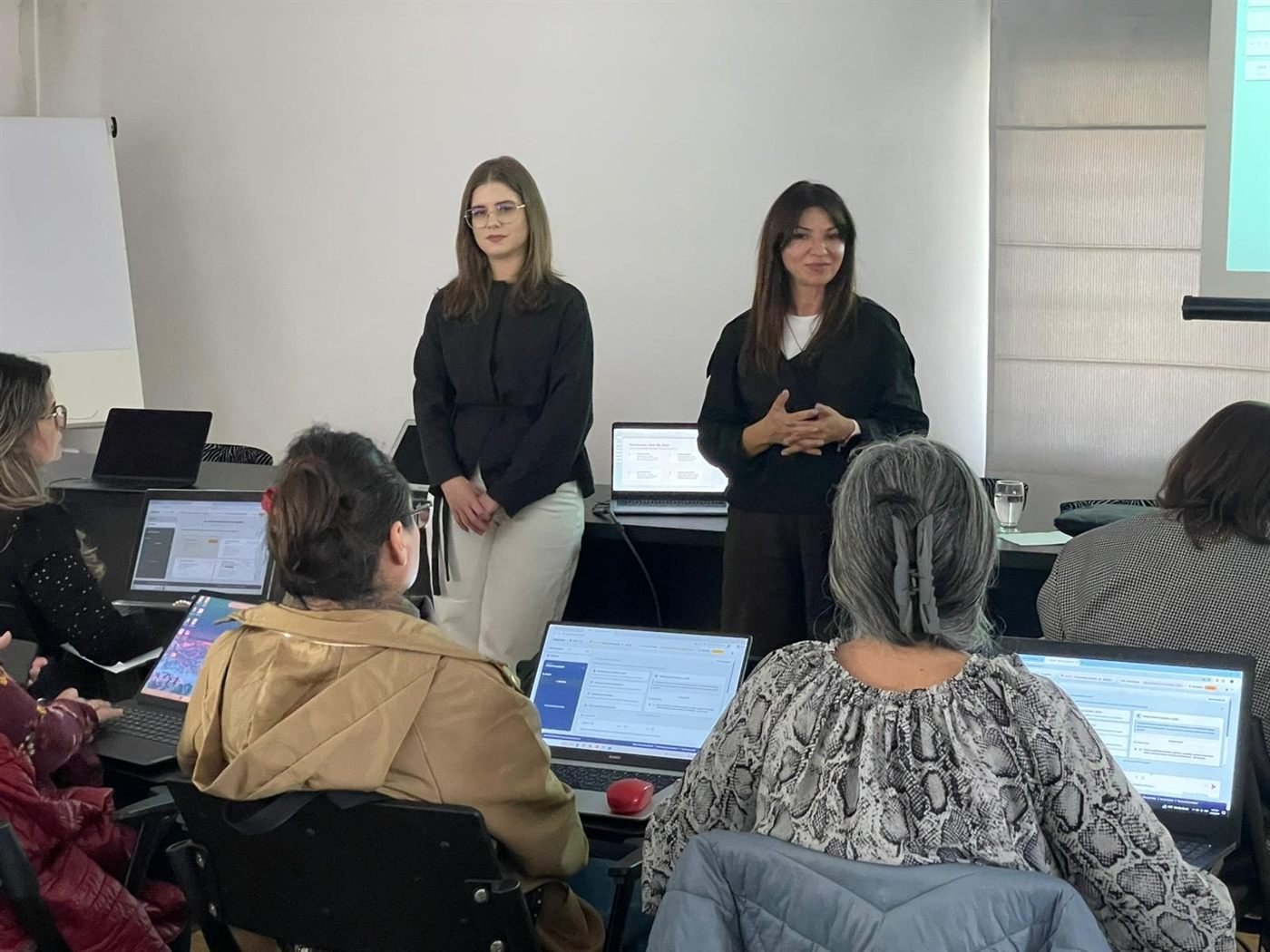 Ana and Maria presenting at the Cluj Bar Association